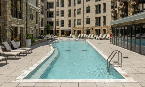 Sparkling swimming pool a pool in a courtyard between buildings