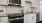 a kitchen with white cabinets