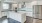 a kitchen with white cabinets